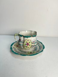Intricately Detailed Teacup And Saucer Set