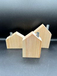 A Trio Of Wooden Decorative Houses