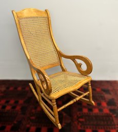 Gorgeous Antique Scroll Arm Rocking Chair With Cane Seat And Back