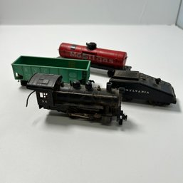 Set Of Four Miniature Model Trains, Including Mobil Gas, Pennsylvania & NYC Cargos, And One Engine