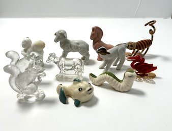 A Large Collection Of Animal Figurines, Including Squirrels, Sheep, Caterpillar