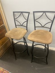 Pair Of Swivel Bar Stools With Tan Upholstered Seats