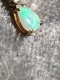 14k Opal Pendant .6 Grams W Diamond