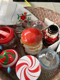 Hat Box Full Of Holiday Canisters And Embroidered Linens