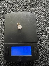 14 Karat Diamond Pendant. The Weight Is .9 G This Is Marked 14 K. Guaranteed.