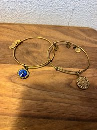 Pair Of Alex And Ani Bracelets With Eight Charms