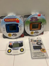 Four Vintage Handheld Games