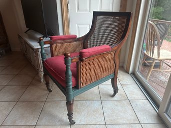 Vintage Cane Back Armchair With Red Cushions And Turned Wood Legs