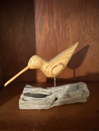 Wood Carved Bird On Driftwood