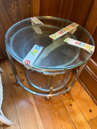 2 Round Glass Top Nesting Tables On Wheels