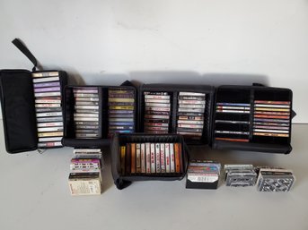 Group Of Prerecorded Music Cassettes And Some Music CDs In Case Logic Cases