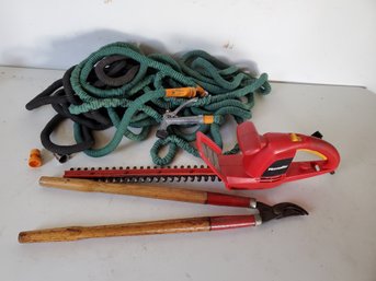Gardening Lot Including Pair Of Pocket Hoses And Electric Trimmer