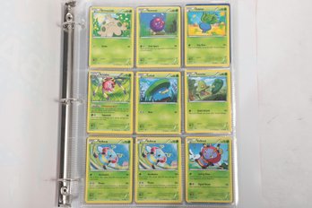 Assorted Pokemon Cards In Binder