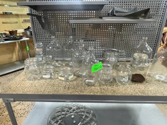 Group Of Clear Glass Bottles And Jars