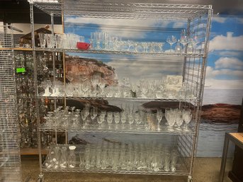 Large Grouping Of Drinking Glasses And Crafts On All 4 Shelves
