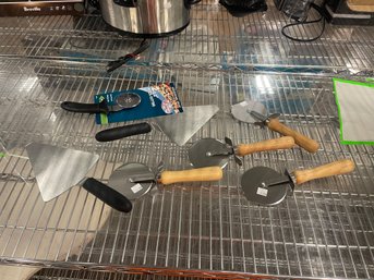 Group Of Pizza Cutters And Spatulas