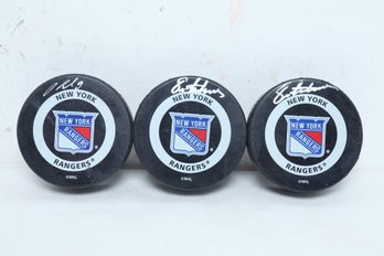 3 Autographed New York Rangers Hockey Pucks