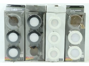 Group Of Color Changing Puck Lights Open Boxes