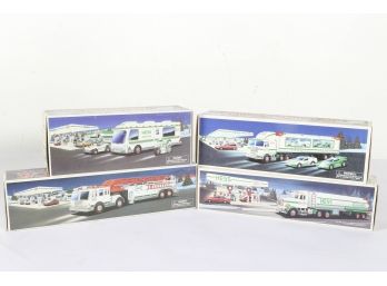 Group Of 4 Toy Hess Trucks In Original Packaging.