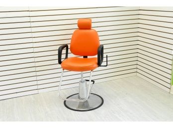 Orange Salon Chair With Head Rest.