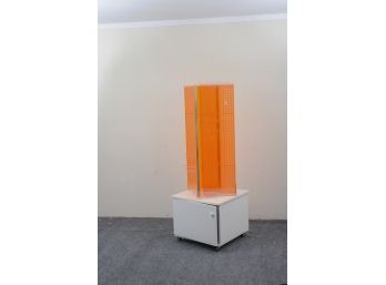 Rotating Orange Plastic Pegboard Display With Storage