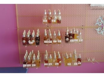 Large Group Of Scented Oils With Display Shelves