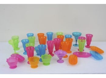 Colorful Lot Of Plastic Dessert Dishes