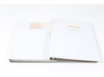 Two Binders Containing Photographic Slides.