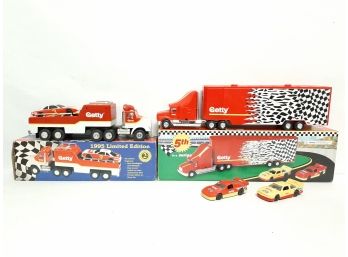 Lot Of (2) Limited Edition Getty Race Car Carrier And Car Transporter Trucks Battery Operated