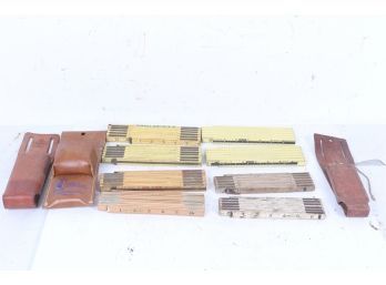 Group Of Folding Rulers With Leather Holders