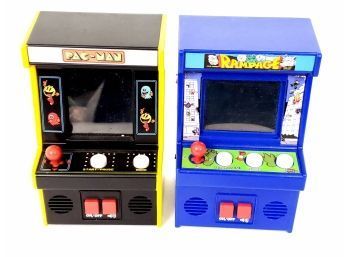 2 Hand-held Electronic Arcade Games Including Pac-man Item 09562 And Rampage Item 09591