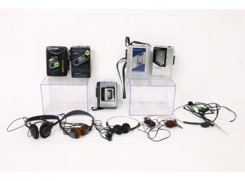 Group Of Vintage Walkman Cassette Players And Accessories