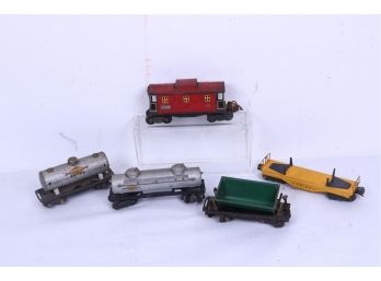 LIONEL O SCALE VINTAGE ANTIQUE METAL CABOOSE # 657 RED, # 654 SUNOCO GAS And 6465, Dump Truck,  Pipe Car
