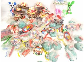 Mixed Lot Of Carnival Prizes, Paper Hats, Tin Noise Makers, Ball In Cup Games And More.