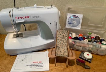 Singer Simple Sewing Machine And Assorted Notions