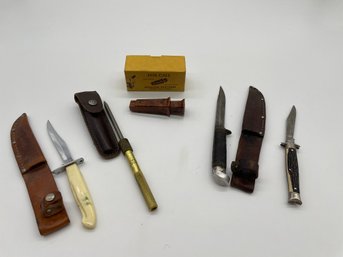 Collection Of Hunting Knives And Fox Call