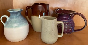 Four Stoneware Pitchers