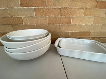 Assortment Of White Serving Bowls And Bakeware