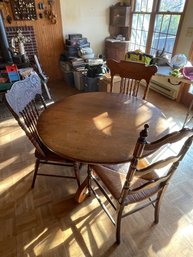 Round Wooden Table And Three Chairs