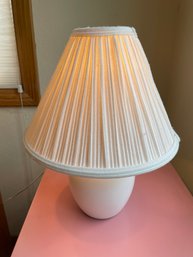 Pink Metal Filing Cabinet With Small White Lamp