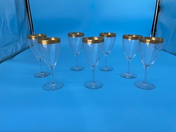 Seven Wine Glasses With Gold Rim