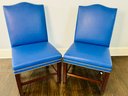 Pair Of Custom Rich Blue Faux Leather Side Chairs With Nailhead Detail And Dark Wood Frame