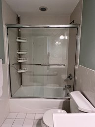 Two Sliding Glass Shower Doors With Chrome Track