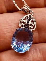 12x9mm Oval Blue Color Change Fluorite With 6 Sapphire Zircon Rhodium Over Sterling Silver Pendant