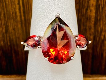 15x10mm Red Zircon Pear Shape With Pair Of 6x4mm Pear Side Stones Rhodium Over Silver Ring - Size 6