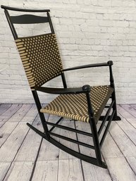 Painted Wooden Rocking Chair With Tan And Brown Woven Seat And Back With Blanket Bar