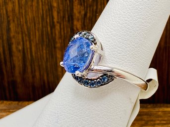 1.57ct Oval Tanzanite With .14CTW Round Blue Sapphire Sterling Silver Ring - Size 6