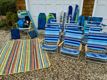 Collection Of Beach Chairs, Umbrellas And Sun Ninja Tent
