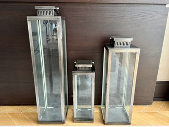 Collection Of Three  Riado Metal And Glass Hurricane Lanterns