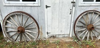 EXTREMELY Heavy Pair 43' Diam. Antique Metal Rimmed Wagon Wheels Manufactured By The Studebaker Wagon Co.